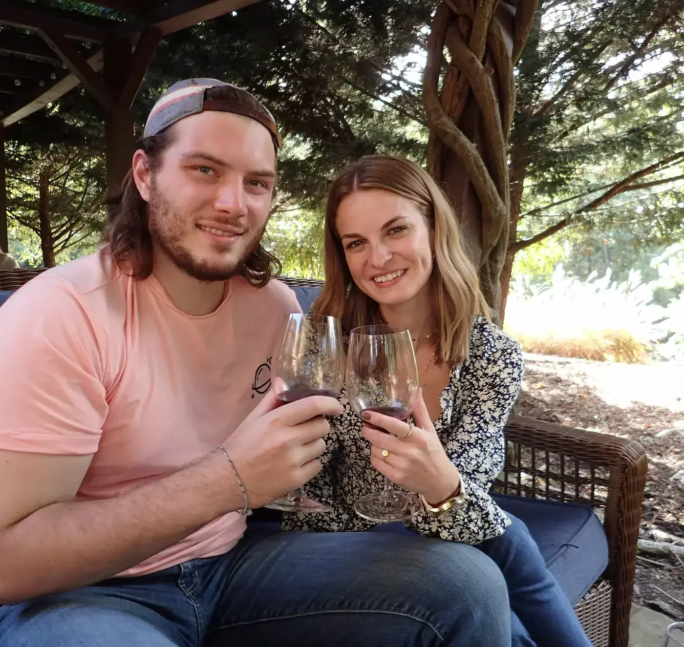 Couple enjoying red wine together at a Virginia winery during a Vino Virginia tour, celebrating connection and local wine country experiences.